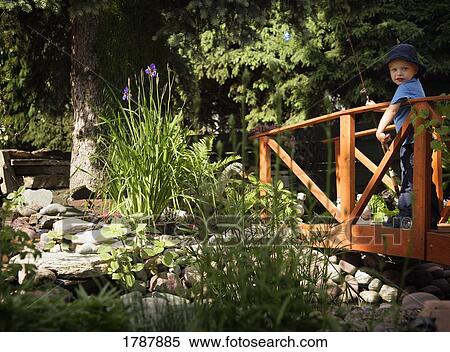 Stock Photography - Little boy with a fishing rod. Fotosearch