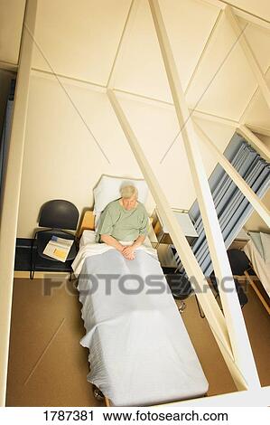 Looking down on man in hospital bed View Large Photo Image Stock Image - Looking down on man in hospital bed. Fotosearch