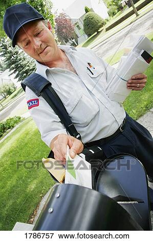Stock Photo - Mail carrier delivering mail. Fotosearch