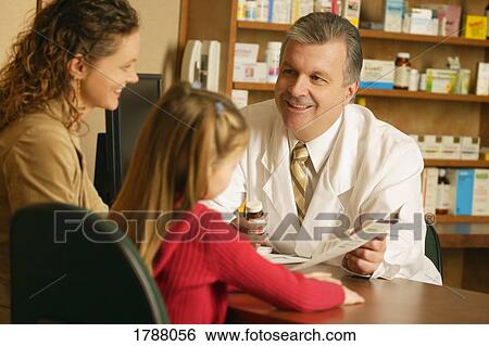 Mother and daughter at pharmacy View Large Photo Image Stock Photograph - Mother and daughter at pharmacy. Fotosearch