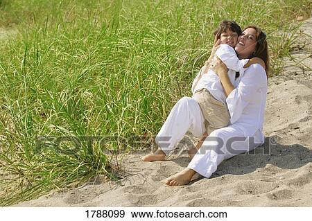 Mother and son on beach View Large Photo Image Stock Photo - Mother and son on beach. Fotosearch