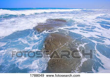 Stock Photo - Ocean waves at high tide. Fotosearch