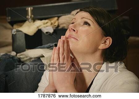 Praying for God's help View Large Photo Image Stock Photograph - Praying for God's help. Fotosearch