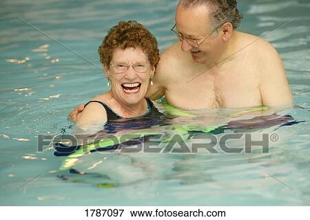Senior couple in swimming pool View Large Photo Image Stock Photo - Senior couple in swimming pool. Fotosearch