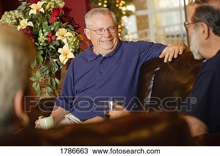 Senior men conversing View Large Photo Image Stock Image - Senior men conversing. Fotosearch