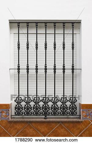 Spanish window with security grill View Large Photo Image Stock Image - Spanish window with security grill. Fotosearch
