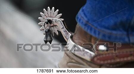 Stock Image - Spur on cowboy boot. Fotosearch
