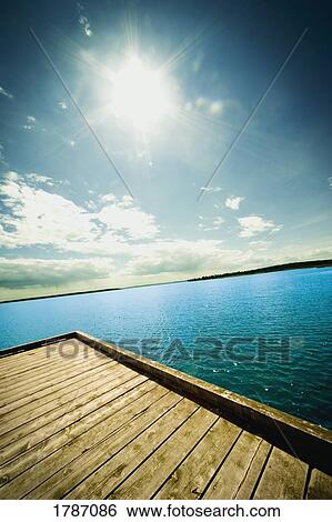 Stock Photograph - Sunshine and the dockside. Fotosearch