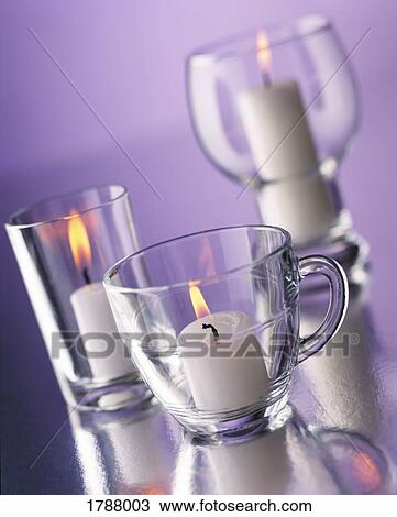 Stock Image - Three burning candles. Fotosearch