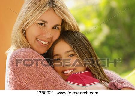 Two sisters embracing View Large Photo Image Stock Image - Two sisters embracing. Fotosearch