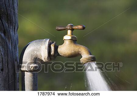 Picture - Water gushing from spout. Fotosearch