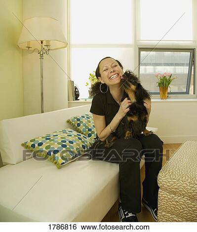 Stock Photograph - Woman and pet dog. Fotosearch