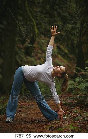 Stock Photograph - Woman doing yoga. Fotosearch