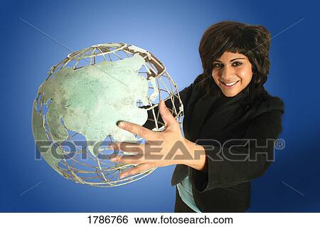 Woman holding a wire globe View Large Photo Image Stock Photograph - Woman holding a wire globe . Fotosearch