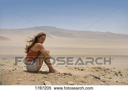 Stock Photography - Woman in the desert. Fotosearch
