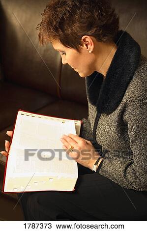 Woman reading the Bible View Large Photo Image Stock Image - Woman reading the Bible. Fotosearch