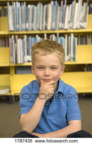 Young boy at the library View Large Photo Image Stock Photography - Young boy at the library. Fotosearch