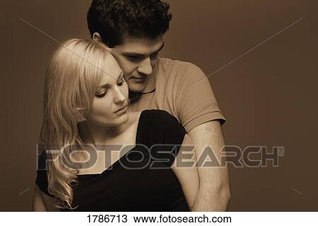 Stock Image - Young couple caressing. Fotosearch