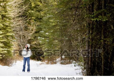 Stock Photograph - Young girl in forest. Fotosearch