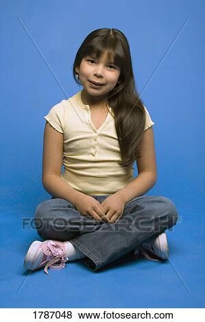 Young girl sitting View Large Photo Image Stock Photo - Young girl sitting. Fotosearch