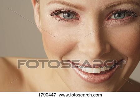 Stock Photo - A woman smiling. Fotosearch