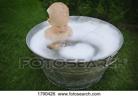 Baby forms a bubble heart in bath View Large Photo Image Stock Photograph - Baby forms a bubble heart in bath. Fotosearch
