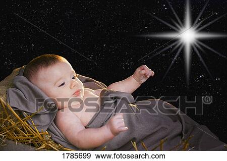 Stock Photo - Baby Jesus in a manger. Fotosearch