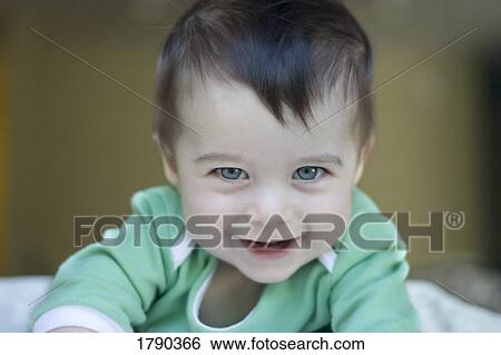 Stock Photograph - Baby laughing. Fotosearch