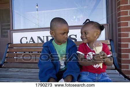 Boy and girl disagreeing over ice cream cone View Large Photo Image Stock Image - Boy and girl disagreeing over ice cream cone. Fotosearch