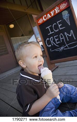 Stock Image - Boy eating ice cream. Fotosearch