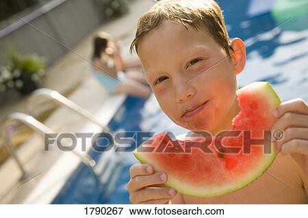 Boy eating watermelon View Large Photo Image Stock Photo - Boy eating watermelon. Fotosearch