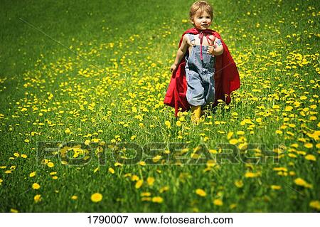 Stock Photo - Boy playing in cape. Fotosearch