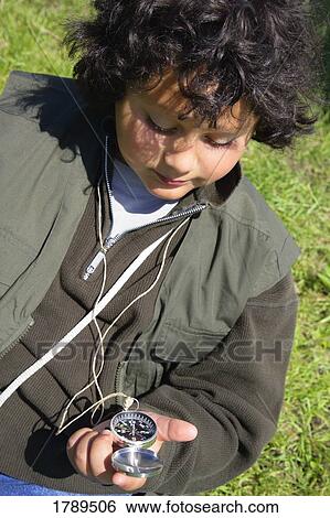 Boy with a compass View Large Photo Image Stock Photograph - Boy with a compass. Fotosearch