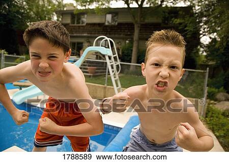 Stock Photo - Boys looking fierce. Fotosearch