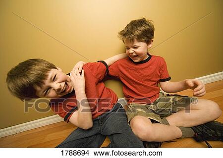 Boys playing together View Large Photo Image Picture - Boys playing together. Fotosearch