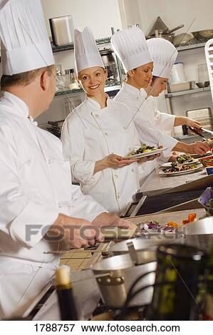 Chefs preparing food View Large Photo Image Stock Photo - Chefs preparing food. Fotosearch