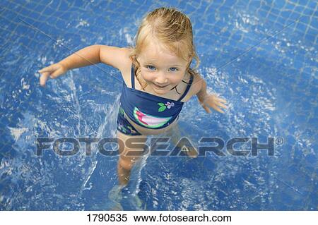 Child in a swimming pool View Large Photo Image Stock Photography - Child in a swimming pool. Fotosearch