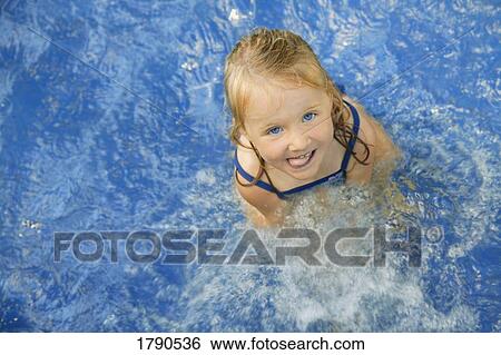 Child in swimming pool View Large Photo Image Stock Photograph - Child in swimming pool. Fotosearch