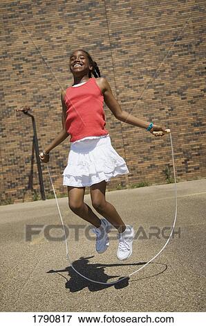 Child jumping rope View Large Photo Image Stock Photo - Child jumping rope. Fotosearch