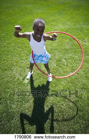 Child playing with hoop View Large Photo Image Stock Photograph - Child playing with hoop. Fotosearch