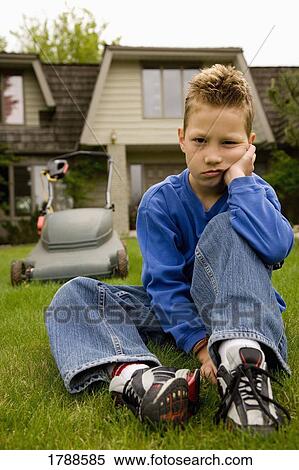 Child refusing to mow the lawn View Large Photo Image Stock Photography - Child refusing to mow the lawn. Fotosearch