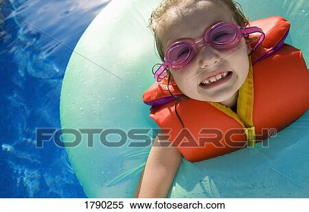 Stock Photography - CLose up of girl with goggles and life jacket. Fotosearch