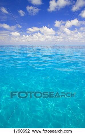 Stock Image - Clouds over Tropical Ocean. Fotosearch