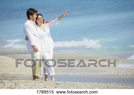 Couple at the beach View Large Photo Image Stock Photography - Couple at the beach. Fotosearch