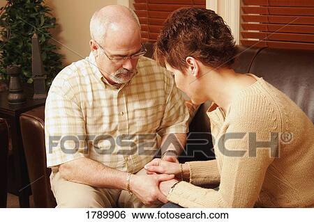 Couple praying together View Large Photo Image Stock Photograph - Couple praying together. Fotosearch