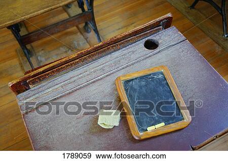Stock Photo - Desk and Chalkboard. Fotosearch