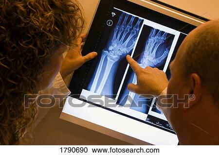 Examining x-rays View Large Photo Image Stock Image - Examining x-rays. Fotosearch