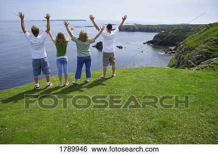 Stock Photograph - Family worship by the sea. Fotosearch