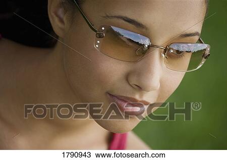 Female in sunglasses View Large Photo Image Stock Image - Female in sunglasses. Fotosearch