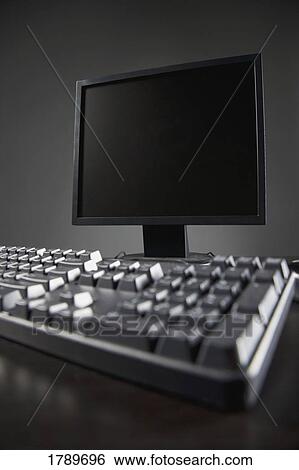 Flatscreen computer monitor with keyboard View Large Photo Image Stock Photograph - Flatscreen computer monitor with keyboard. Fotosearch